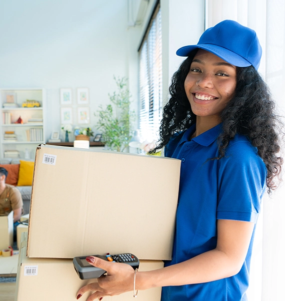 moving services in Missouri crew wrapping a sofa with pads