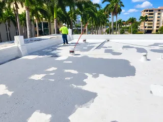 Roof coating around vents on a low-slope roof