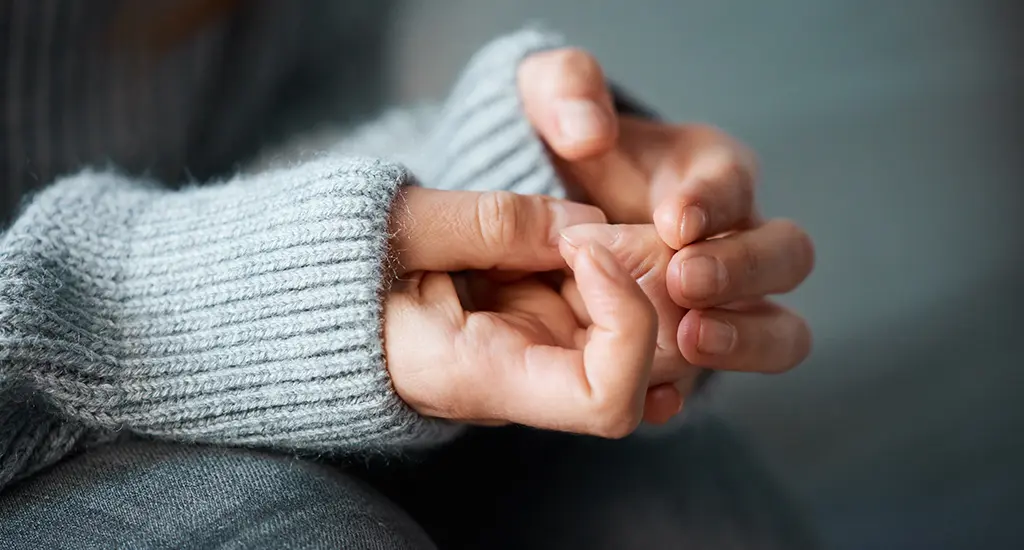 Woman attending online therapy for anxiety from home