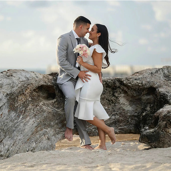 Engagement photos photographer guiding couple pose