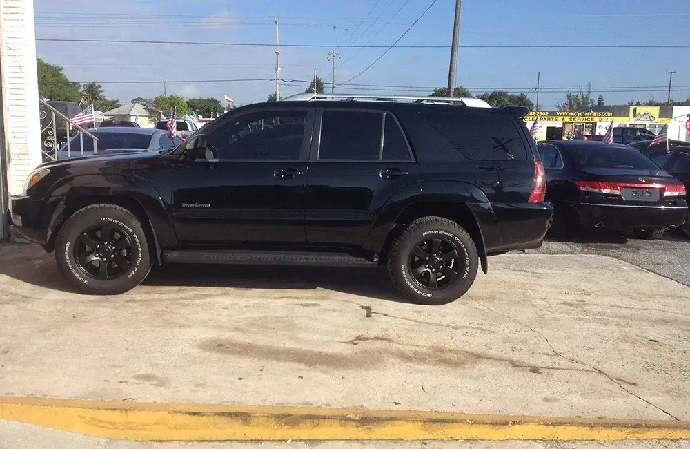 Black SUV parked outside an Auto Body Shop in Merriam for collision repair and bodywork.