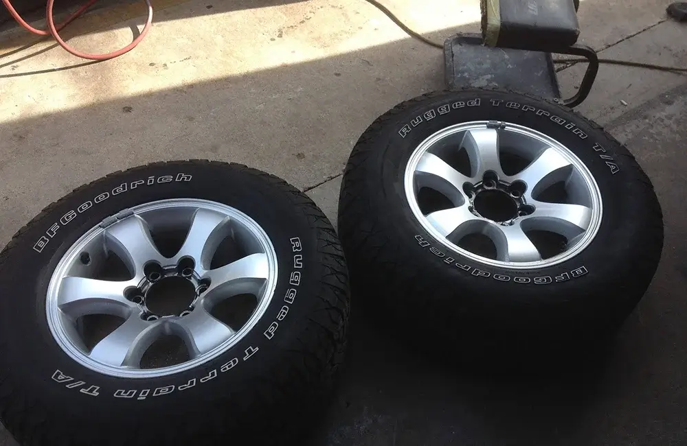 Alloy wheels with BFGoodrich tires ready for service at an Auto Body Shop in Merriam.