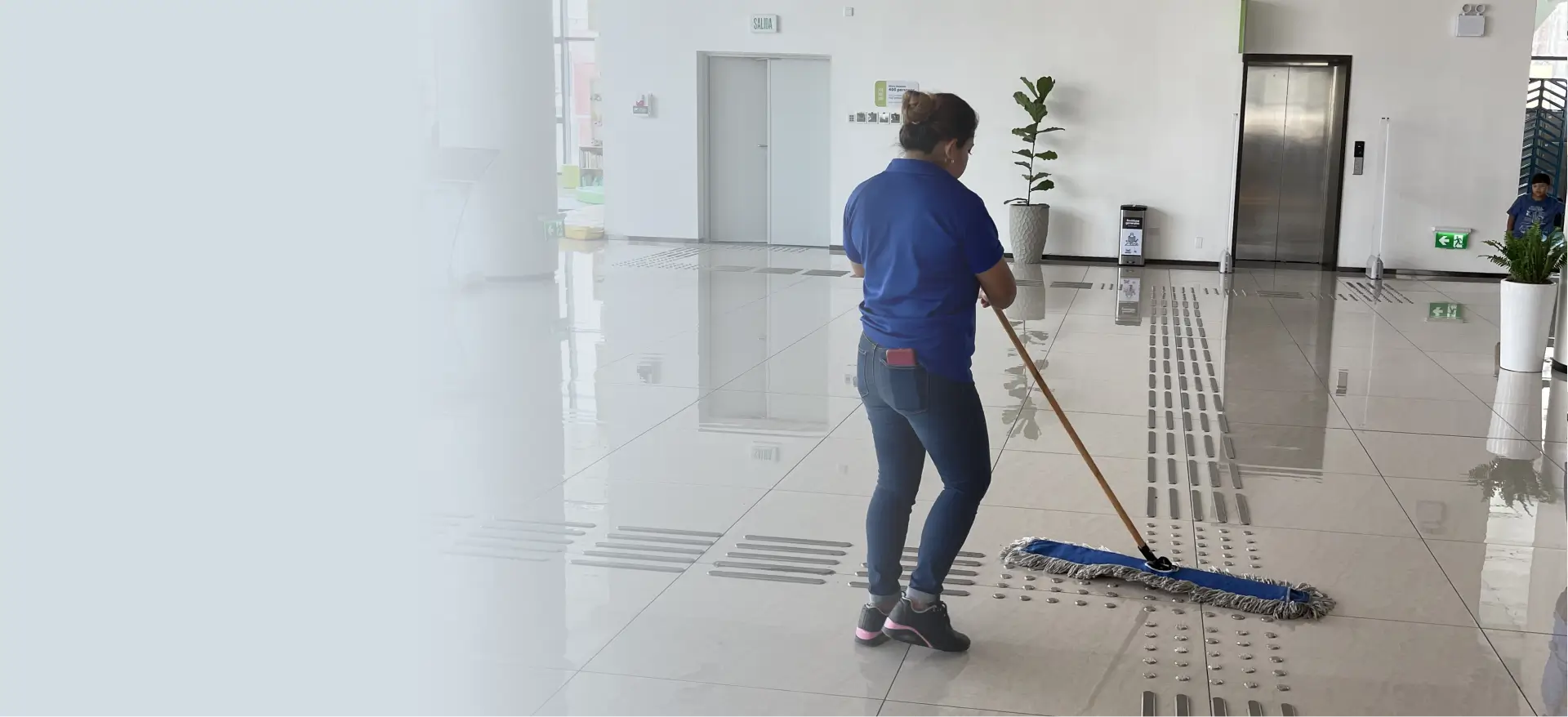 Team providing janitorial services in Atlanta inside a modern office lobby